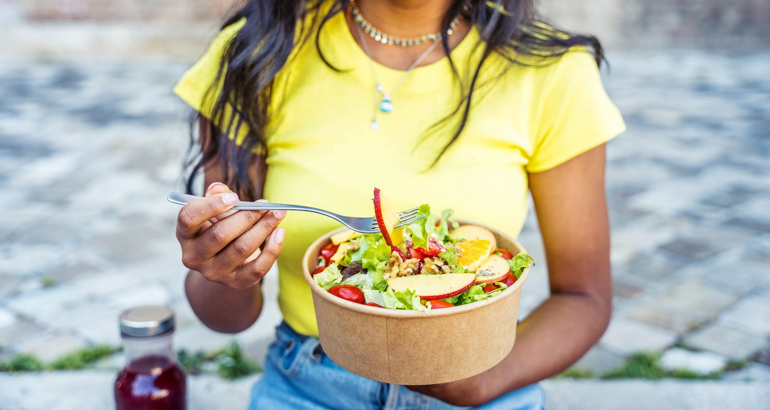 Woman eating salad