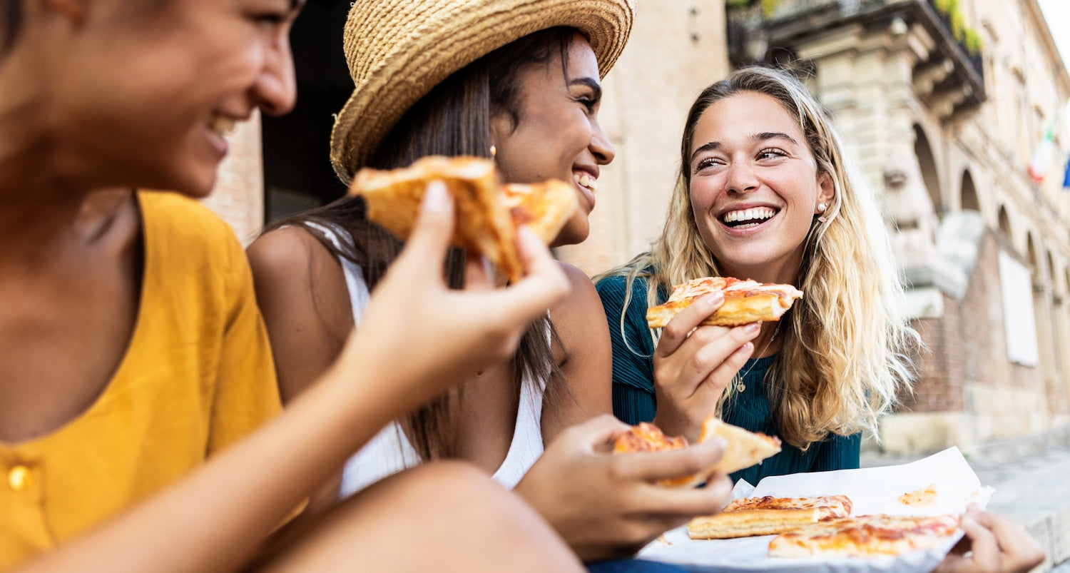 Women eating pizza