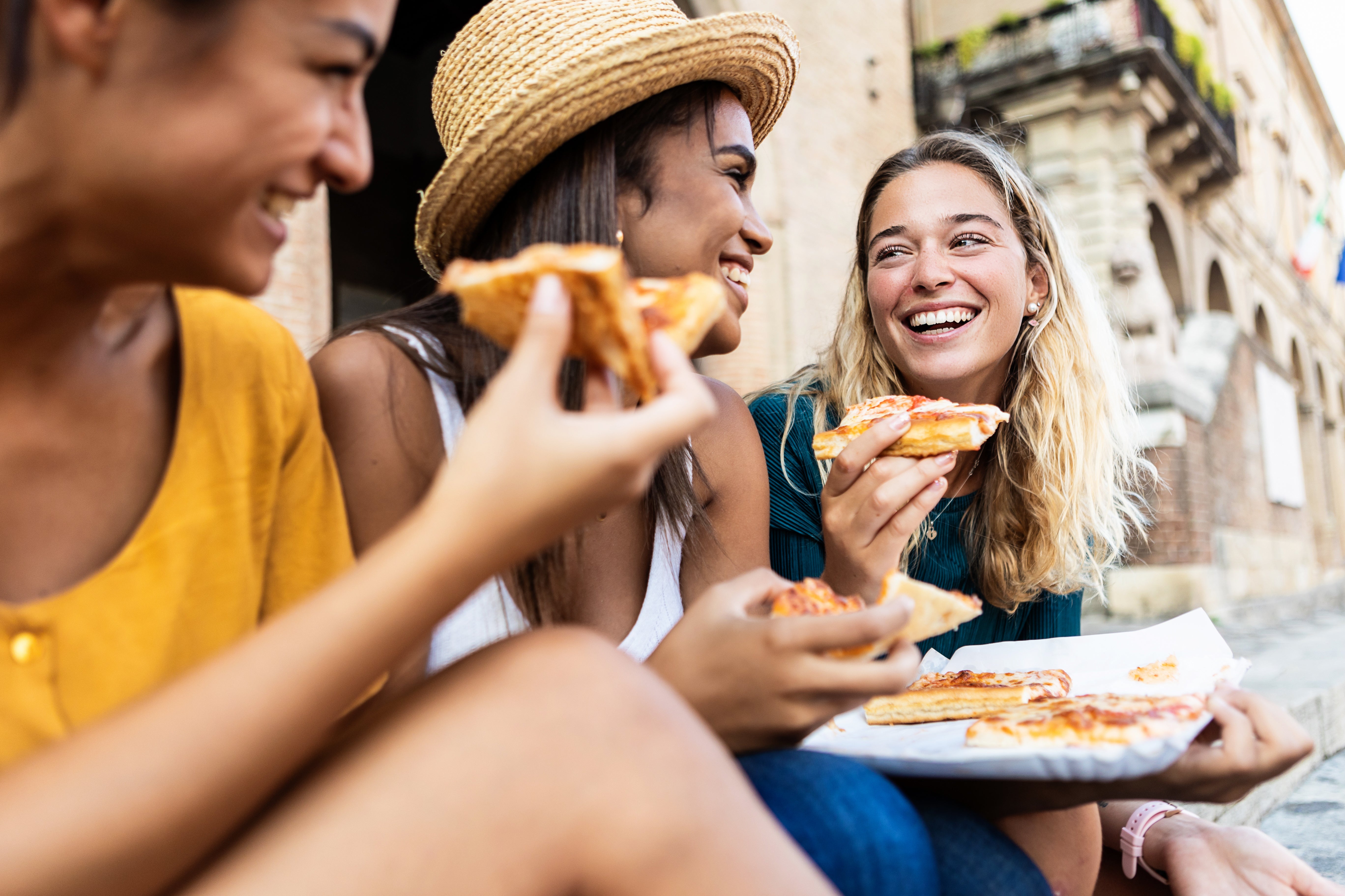 Image_women eating pizza.jpeg